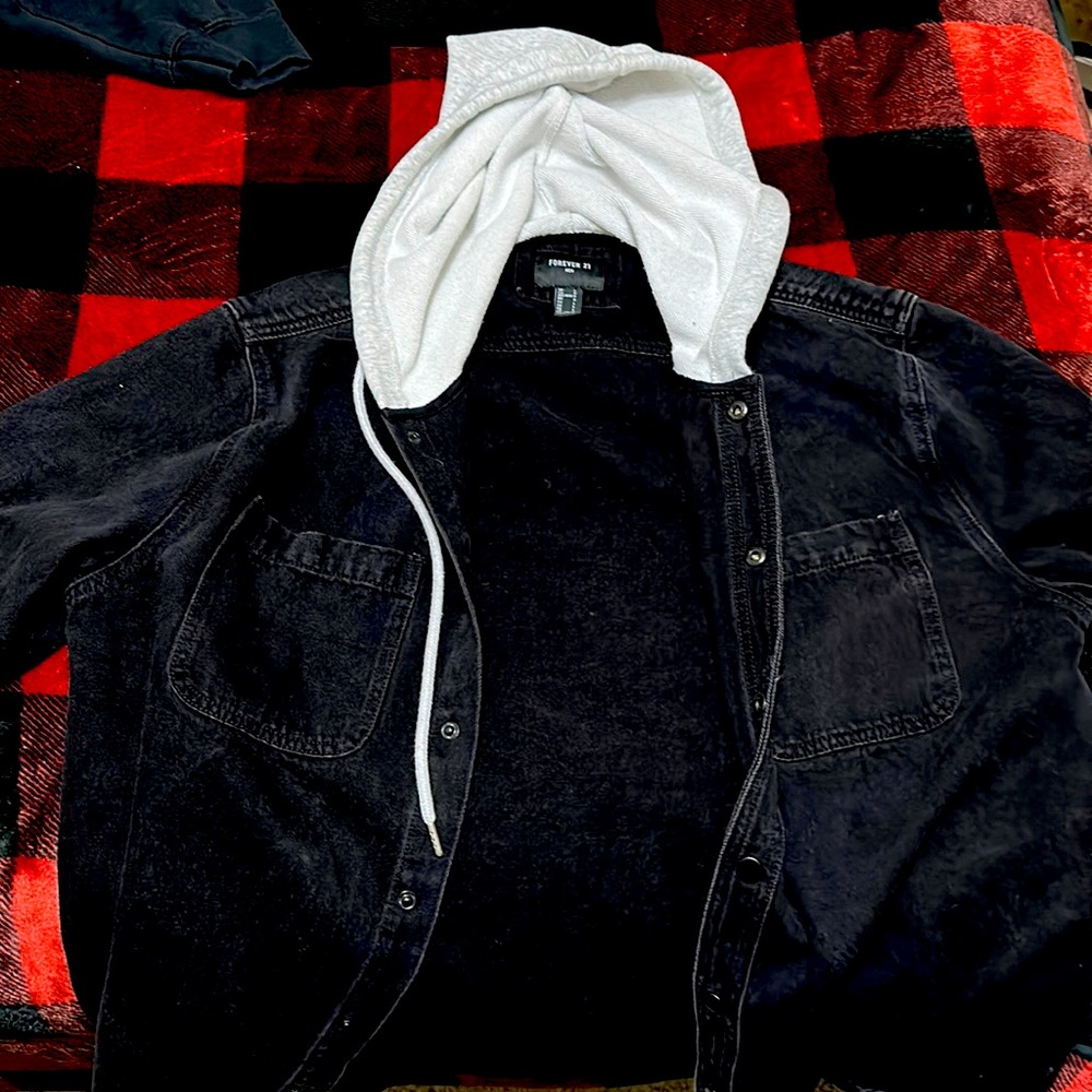 Black jean jacket with grey hoodie